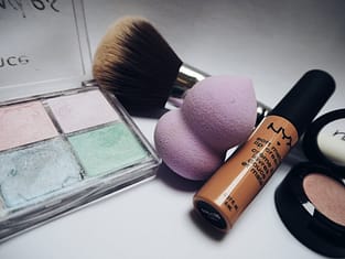 nyx lipstick beside eye shadow palette