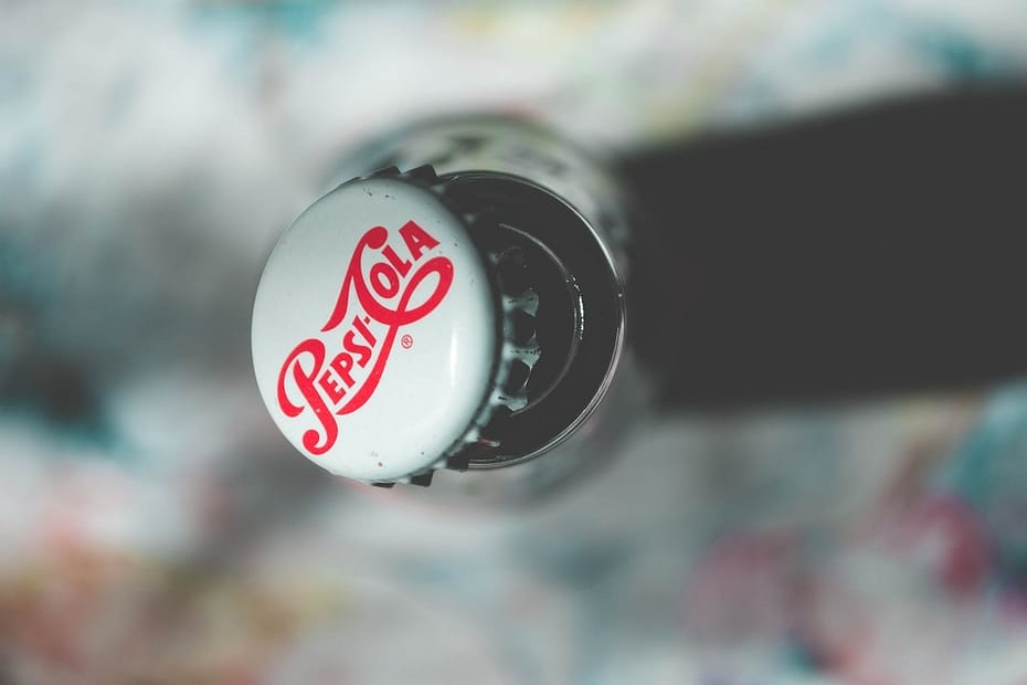 shallow focus photography of pepsi cola bottle cap